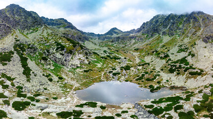 Panoramic view of Skok waterfall and the lake in the western part of High Tatras, Slovakia © Martin Valigursky