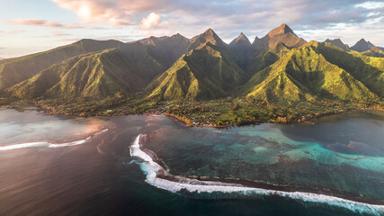Paradise island sunset with mountains and coral reefs. French polynesia, Tahiti, Teahupoo - obrazy, fototapety, plakaty