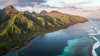 Naklejka na ściany i meble Paradise island sunset with mountains and coral reefs. French polynesia, Tahiti, Teahupoo
