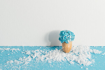 Acorn seed in blue stone glitter texture. Sparkle luxury style with snow.