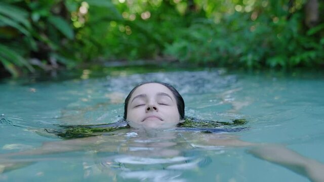 Woman swins at Natural pool in Jalapao National Park Brazil
