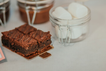 Chocolate delicious brownie cake on the table on white background