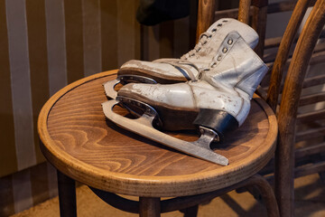 Retro skates on a wooden chair. the USSR.