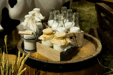 Milk in retro bottles, aluminum cans, straw.