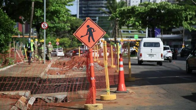 salvador, bahia, brazil - may 26, 2021: civil construction workers are seen during construction of an exclusive lane for the transit of vehicles of the BRT system in the city of Salvador.