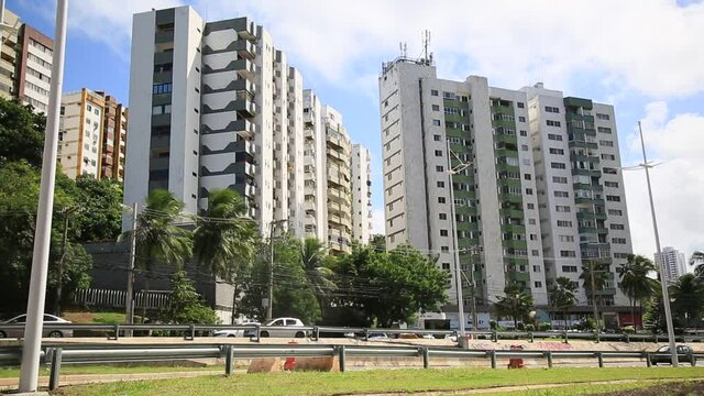 salvador, bahia, brazil - may 26, 2021: view of residential buildings near a vehicular traffic lane in the city of Salvador.