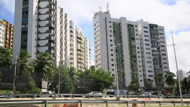 salvador, bahia, brazil - may 26, 2021: view of residential buildings near a vehicular traffic lane in the city of Salvador.