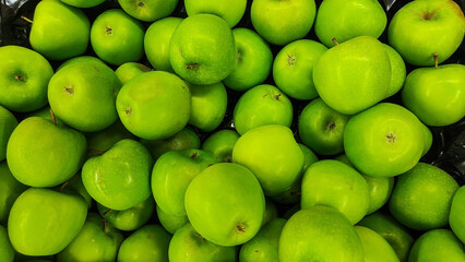 Fresh organic raw green apples background. Top view of ripe green apples