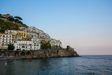 Naklejka premium AMalfi, Italy : 03 april 2019 : Panoramic view of beautiful Amalfi on hills leading down to coast, Campania, Italy. Amalfi coast is most popular travel and holiday destination in Europe.