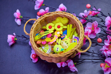 multicolored hair clip in wicker basket