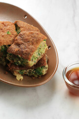 Martabak Telur is Popular Street Food in Indonesia. Egg, Spring Onion Wrapped with Thin Flour Batter