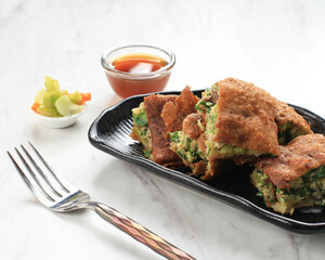 Martabak Telur is Popular Street Food in Indonesia. Egg, Spring Onion Wrapped with Thin Flour Batter