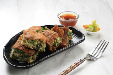 Martabak Telur is Popular Street Food in Indonesia. Egg, Spring Onion Wrapped with Thin Flour Batter