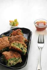 Martabak Telur is Popular Street Food in Indonesia. Egg, Spring Onion Wrapped with Thin Flour Batter