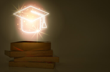 glow in the dark graphics of the graduation cap Floating on piles of old books, in the dark,...