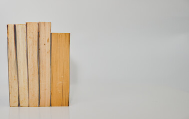 stack of books arranged horizontally on white background