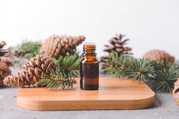 Bottle of coniferous essential oil on table