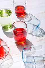 Beautiful glasses on light wooden background