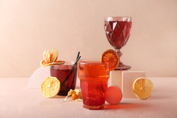 Composition with glasses of tasty cocktails on color background