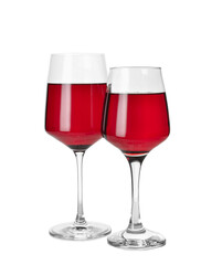 Glasses of delicious red wine on white background