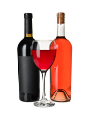 Glass and bottles of delicious red wine on white background