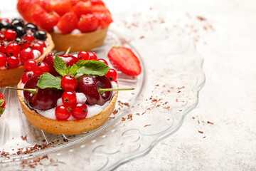 Tasty berry tart on grunge background