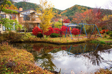 Children playground at luxury houses in autumn
