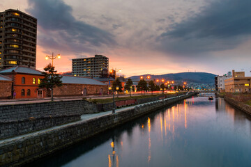 Fototapeta premium Otaru canal with tourist boats at sunset, Hokkaido
