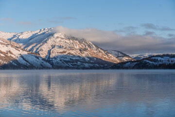 Obraz premium The winter landscape of Kanas lake in Xinjiang province, China, at sunrise.