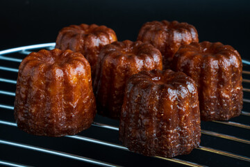 Close up image of  canelé with black background