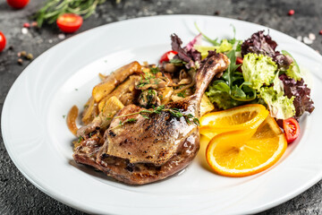 Christmas roast duck served with baked potatoes, mushrooms and onions. Food recipe background. Close up