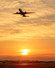 Naklejka na ściany i meble Beautiful Sunset Sky and Airplane