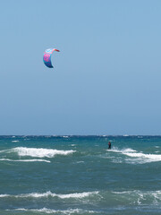 Kitesurfing During a Windy Day with a Very Rough Sea