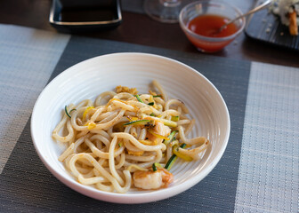  Vegetarian Yaki Udon, Healthy japanese dish at restaurant,background chili sauce.