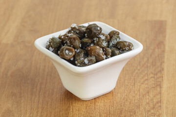 Salted marinated capers snack appetiser