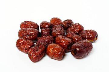 Dried Chinese dates isolated on white background. Close up of dried Chinese red dates or jujube.