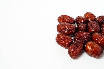 Dried Chinese dates isolated on white background. Close up of dried Chinese red dates or jujube.