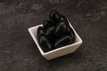 Pickled black olives in the bowl