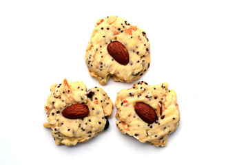 Three different whole grain almond cookies, isolated on white background.
