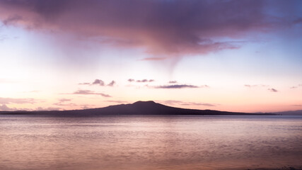 Rangitoto Island at dawn with the rain clouds drifting over, Auckland.