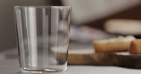 empty tumbler glass on terrazzo countertop
