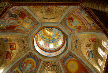 POCHAIV, UKRAINE -2021: Lavra Orthodox Christian Monastery Complex Transfiguration Cathedral Interior Cupola Ceiling Fresco of God Jesus Christ