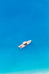 Fototapeta premium Aerial drone view of moored boat near the coast of Zakynthos, Greece
