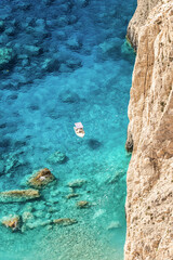 Aerial drone view of moored boat near the coast of Zakynthos, Greece