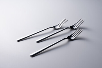 group of modern forks on white background. silverware