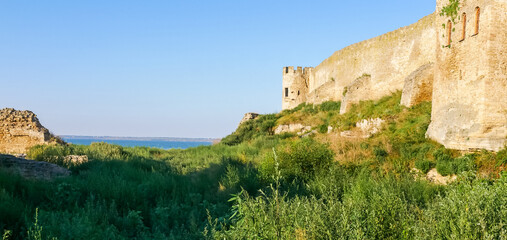 Fototapeta na wymiar Ruins of the Akkerman Fortress. Panoramic view of Bilhorod-Dnistrovskyi fortress, Ukraine. Exteriors of the fortress on a sunny summer day.