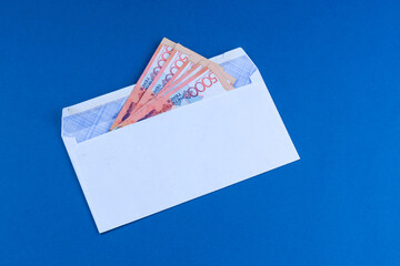 A bribe in the form of money with a face value of 5,000 tenge. Or a salary. Volute: Kazakhstani tenge.