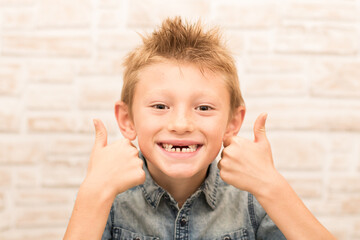 smiling funny child with thumbs up