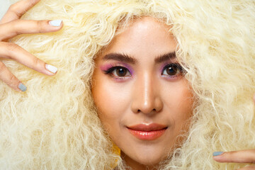 Half Body Portrait of 20s Asian Caucasian beautiful Woman blonde afro hair high fashion make up