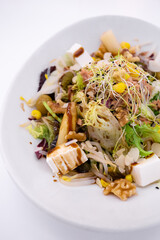 Healthy and delicious salad with tuna, nuts and feta cheese.